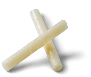 Two ivory-colored cylindrical bone pins crossed in an X shape on a white background.