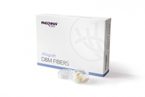A Maxxeus DBM Fibers packaging box beside a small clear dish containing clumped white fiber material.