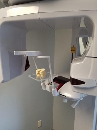 Interior of the CBCT scanner gantry with the surgical table tray positioned in the scan area