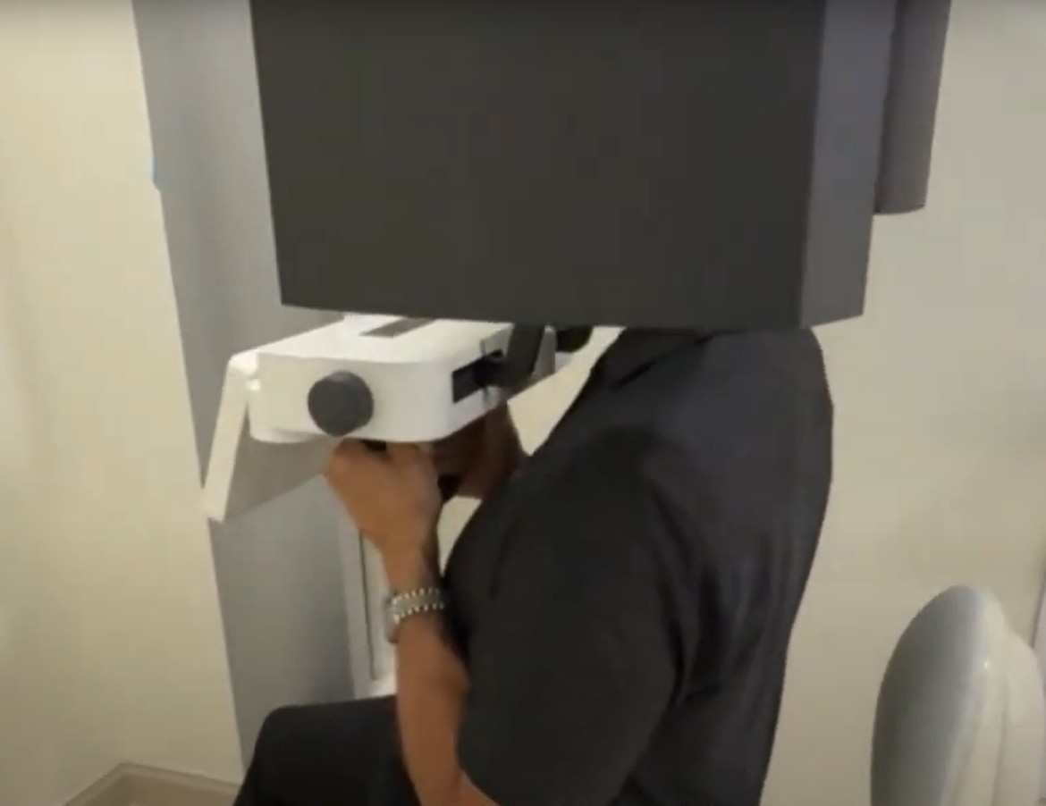Patient seated with shoulders back having CBCT taken in J.Morita X800