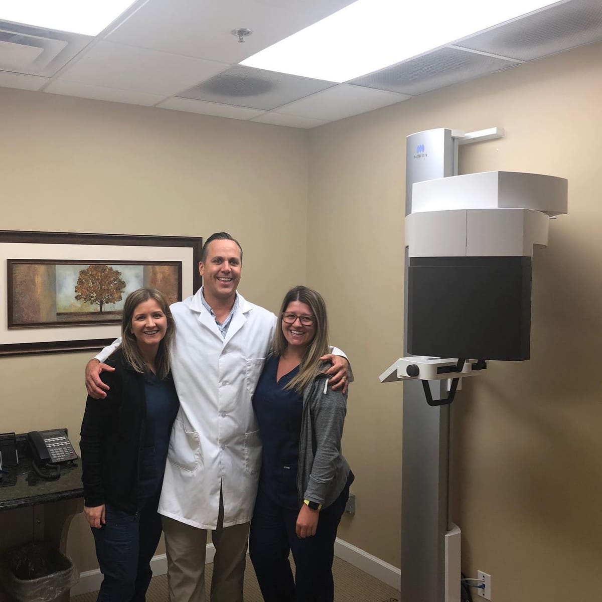 Practice team with their newly installed CBCT unit